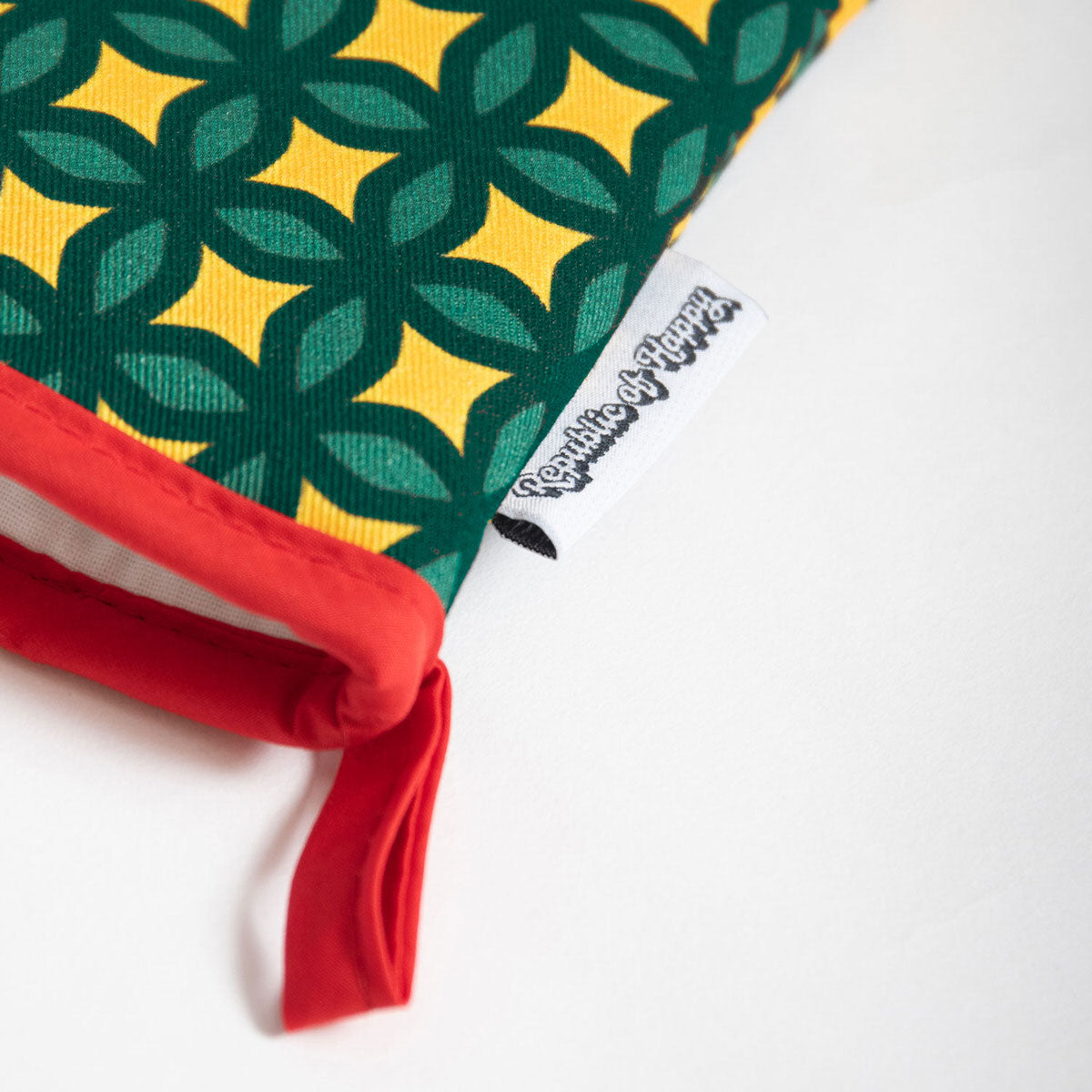 ARALIA LEAVES - Single oven glove with colourful geometric stars pattern
