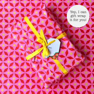 Gift wrapped parcel with a note reading "Yep, I can gift wrap it for you!"